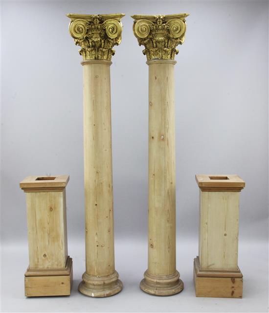 A pair of stripped pine columns, H.9ft 3in.